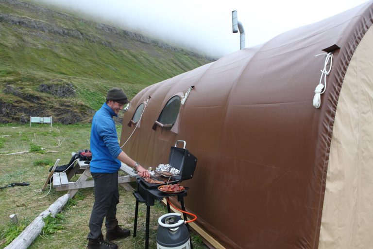 borea adventures guide cooking a meal on a tour
